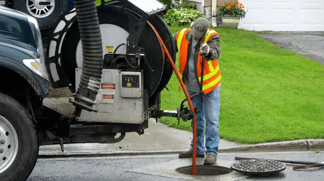 Technician using specialized drainage equipment for sewer line cleaning and foundation protection in Baton Rouge, LA